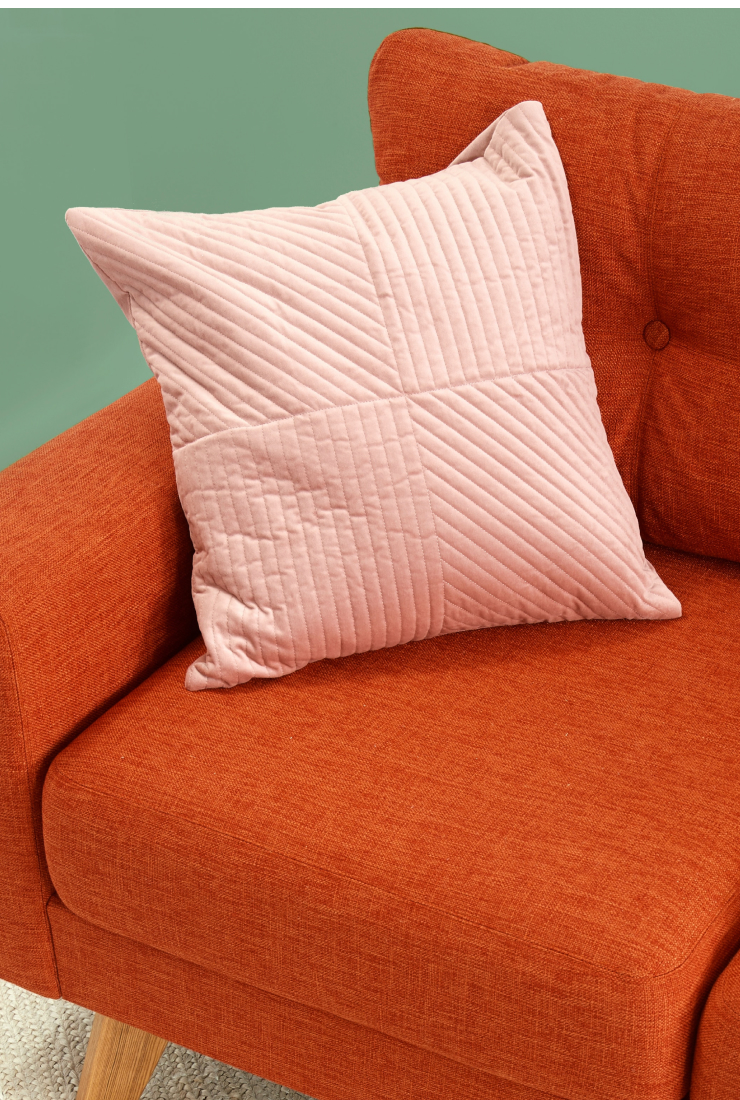 this is a chair with a pink pillow